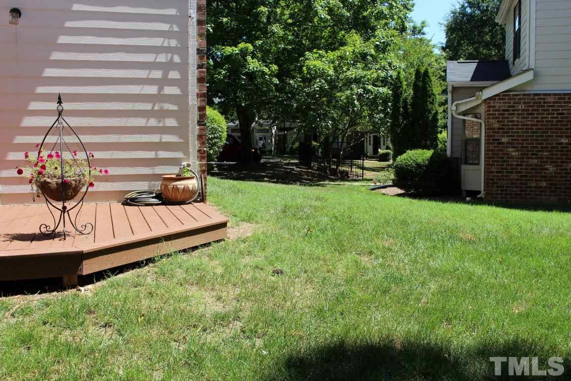 2423 Condor Court Raleigh, NC 27615 - Photo 18 of 20 a view of a garden with a bench