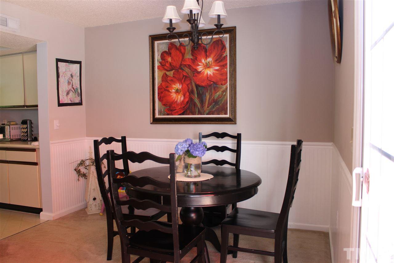 2423 Condor Court Raleigh, NC 27615 - Photo 6 of 20 a view of a dining room with furniture and wooden floor