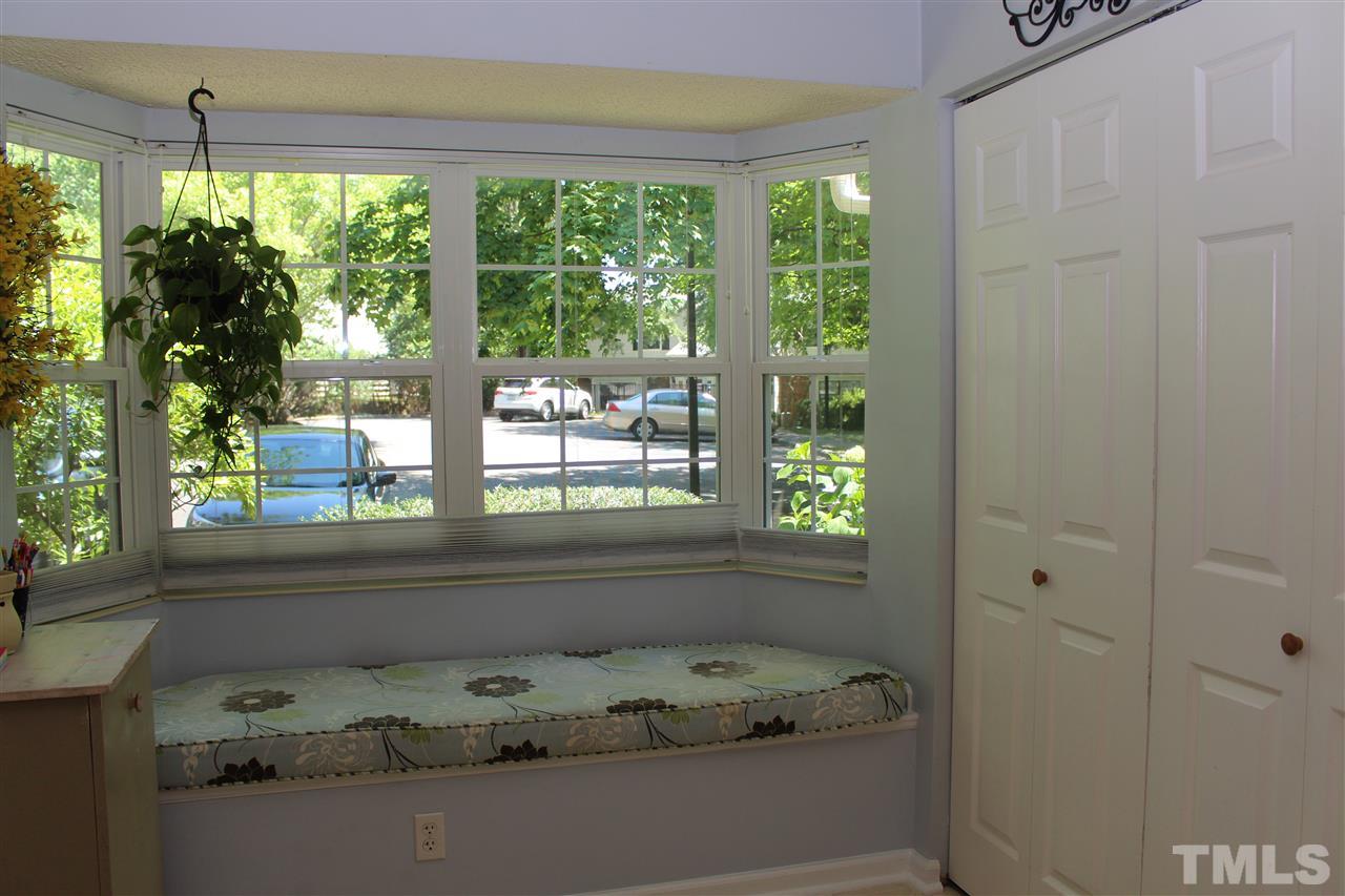 2423 Condor Court Raleigh, NC 27615 - Photo 8 of 20 a bathroom with a tub and window