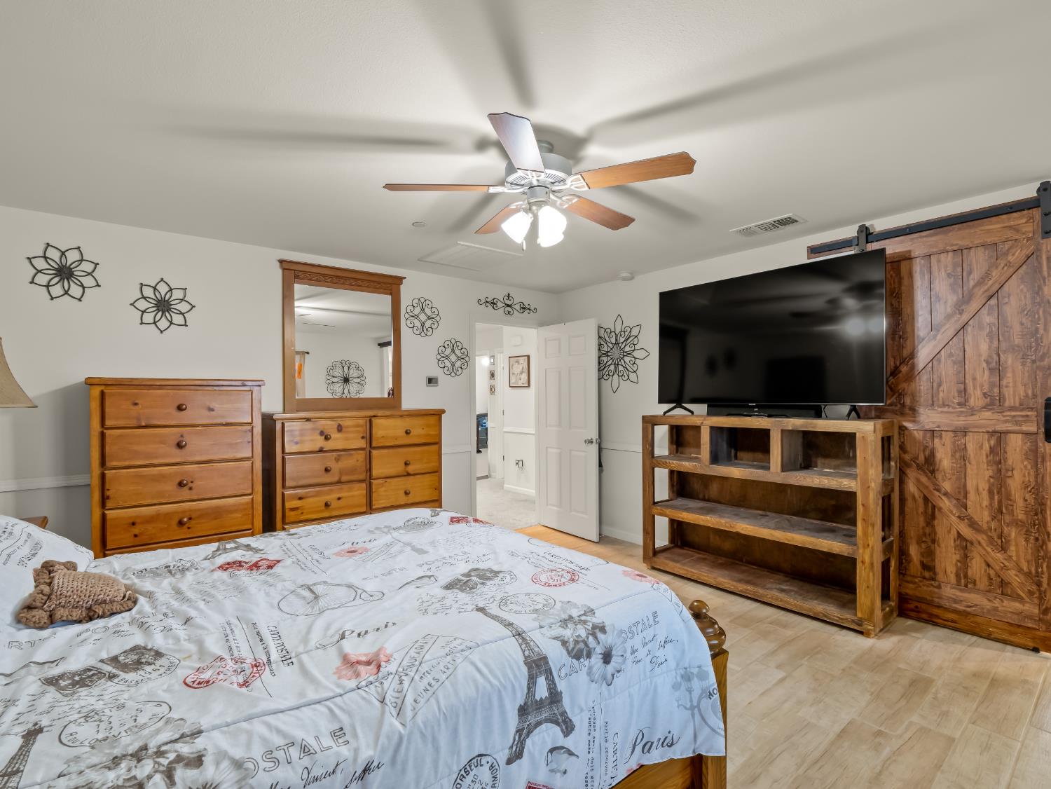 3925 Griffith Avenue Clovis, CA 93619 - Photo 15 of 40 a bedroom with a bed and a flat screen tv