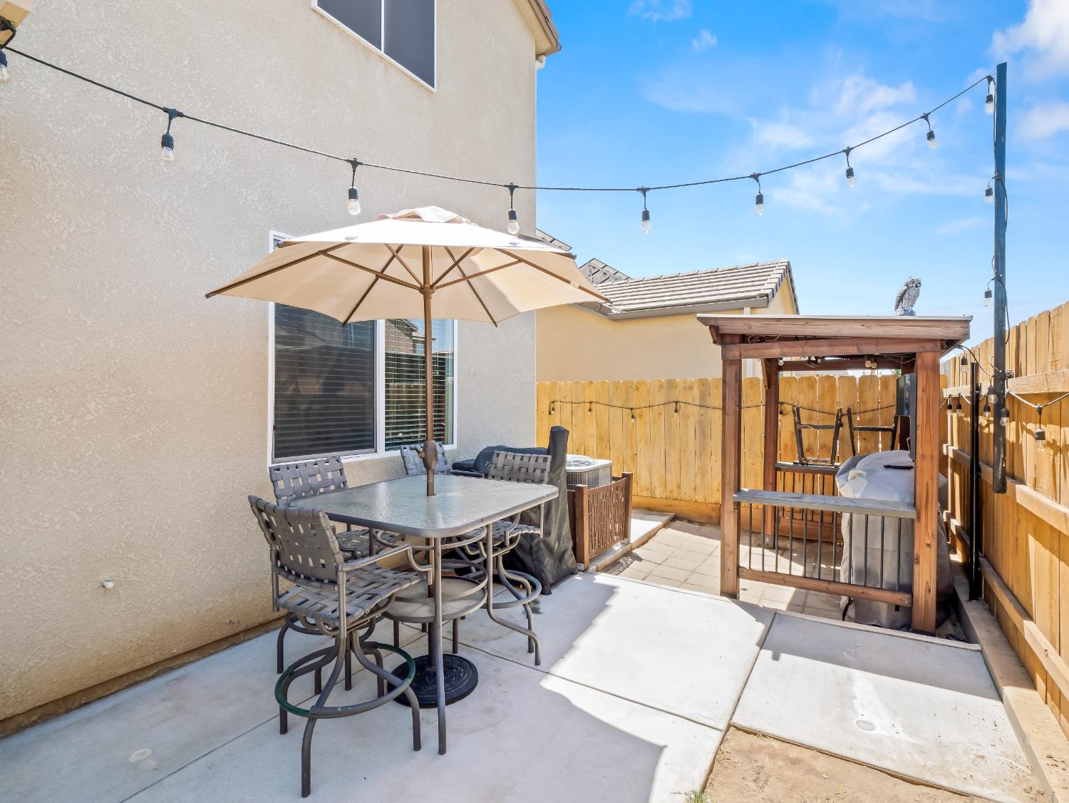 3925 Griffith Avenue Clovis, CA 93619 - Photo 36 of 40 a view of a dining room with furniture wooden floor and chandelier