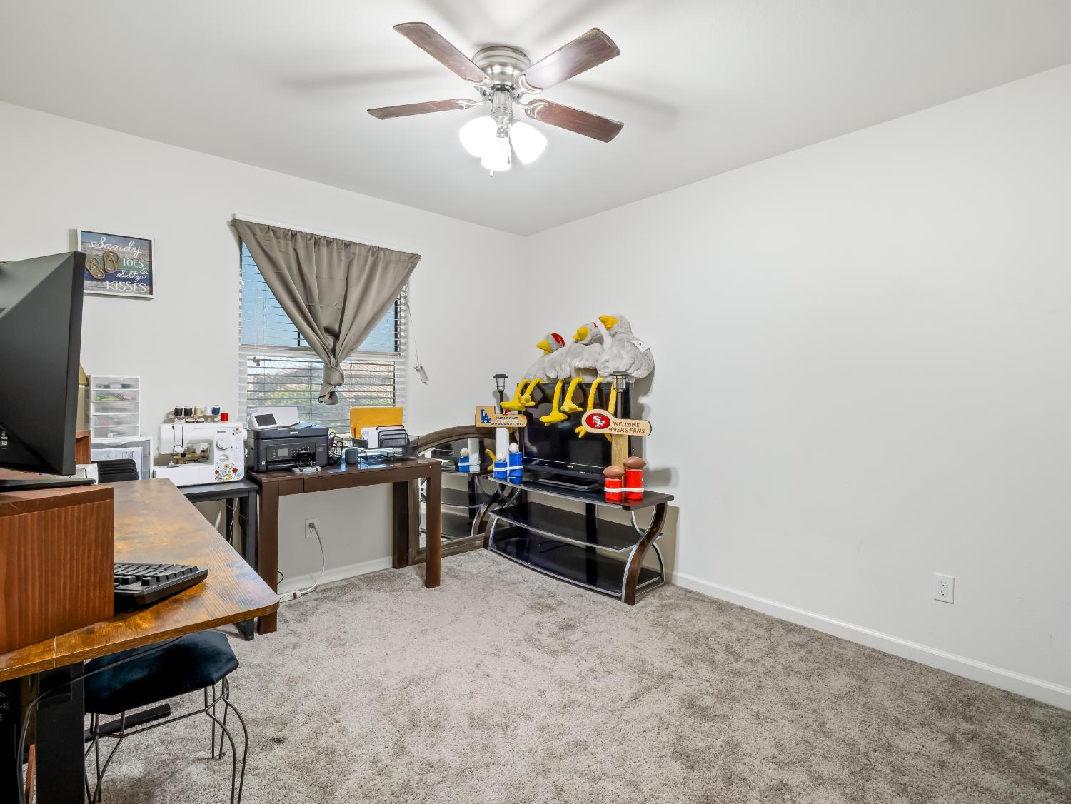 3925 Griffith Avenue Clovis, CA 93619 - Photo 9 of 40 a living room with furniture and a flat screen tv