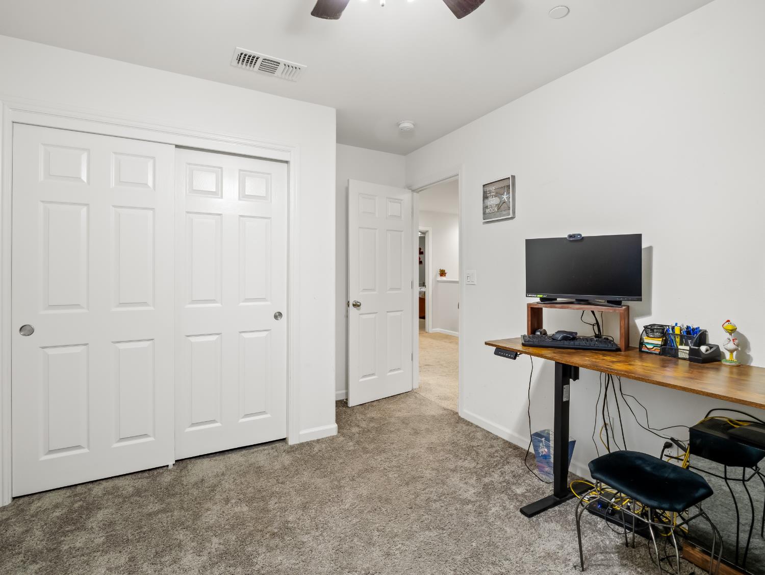 3925 Griffith Avenue Clovis, CA 93619 - Photo 10 of 40 a view of a workspace with furniture and a flat screen tv