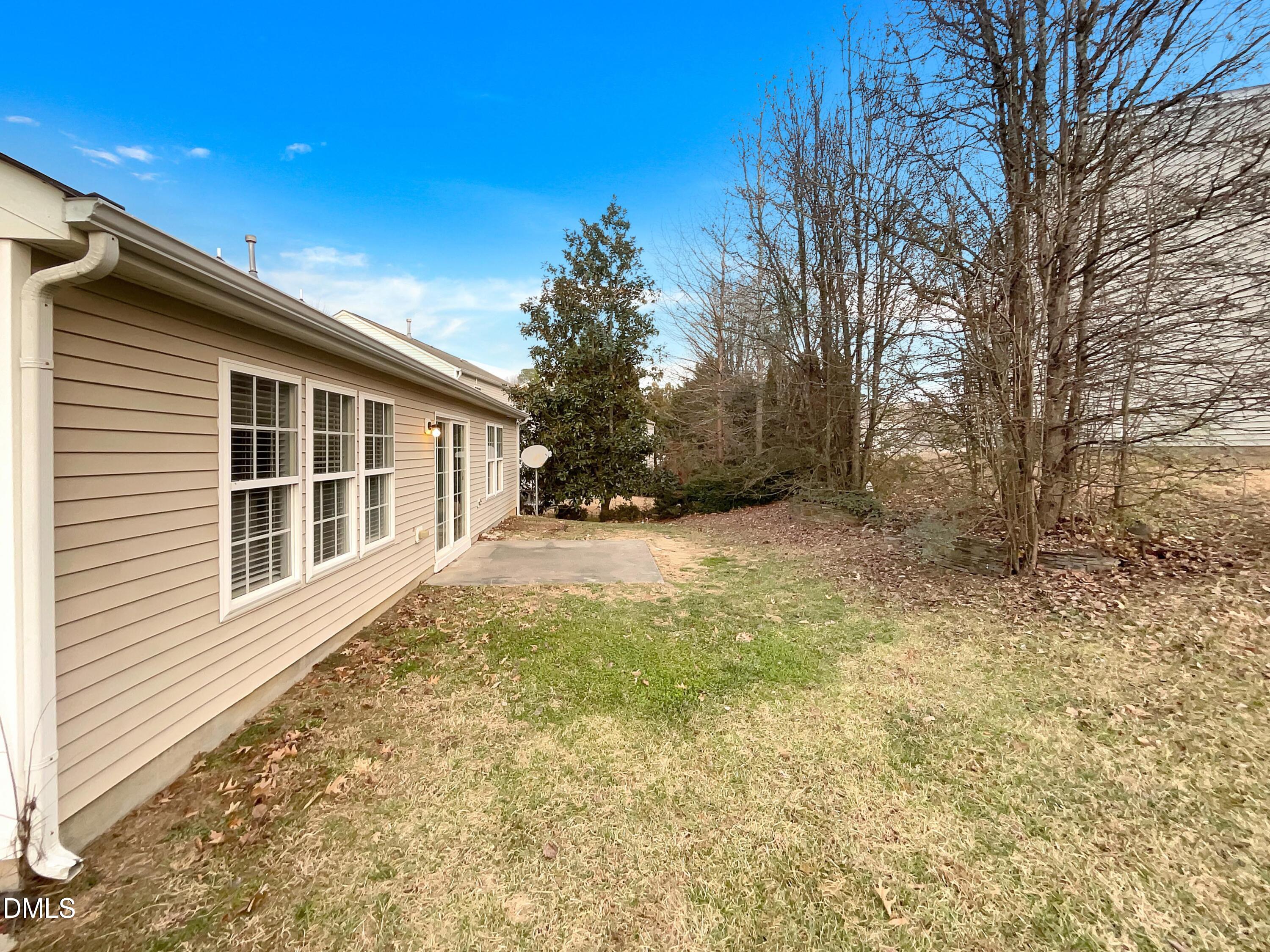 5400 Thunderidge Drive Raleigh, NC 27610 - Photo 15 of 15 a view of house with yard and trees in the background