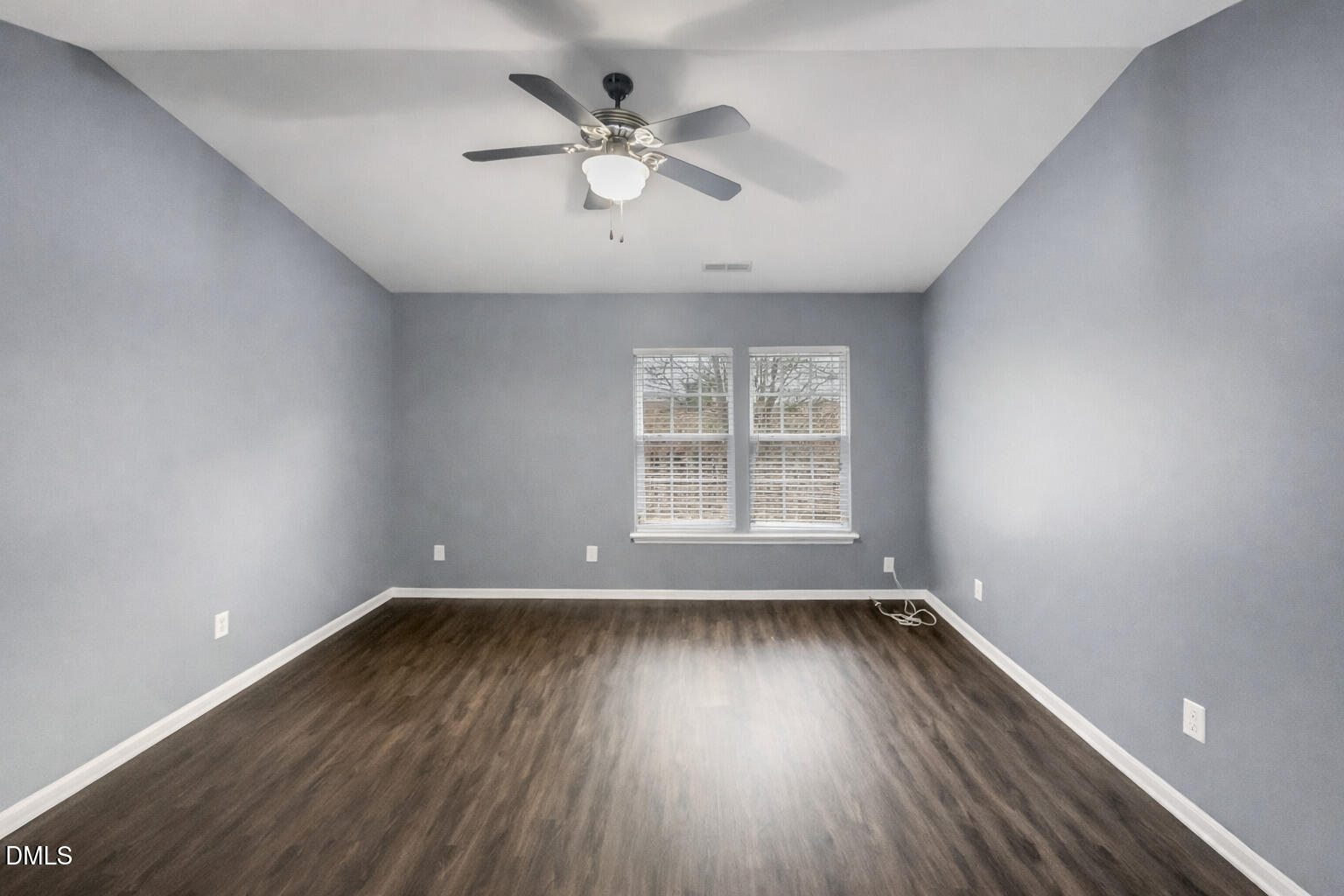 5400 Thunderidge Drive Raleigh, NC 27610 - Photo 4 of 15 an empty room with wooden floor and windows