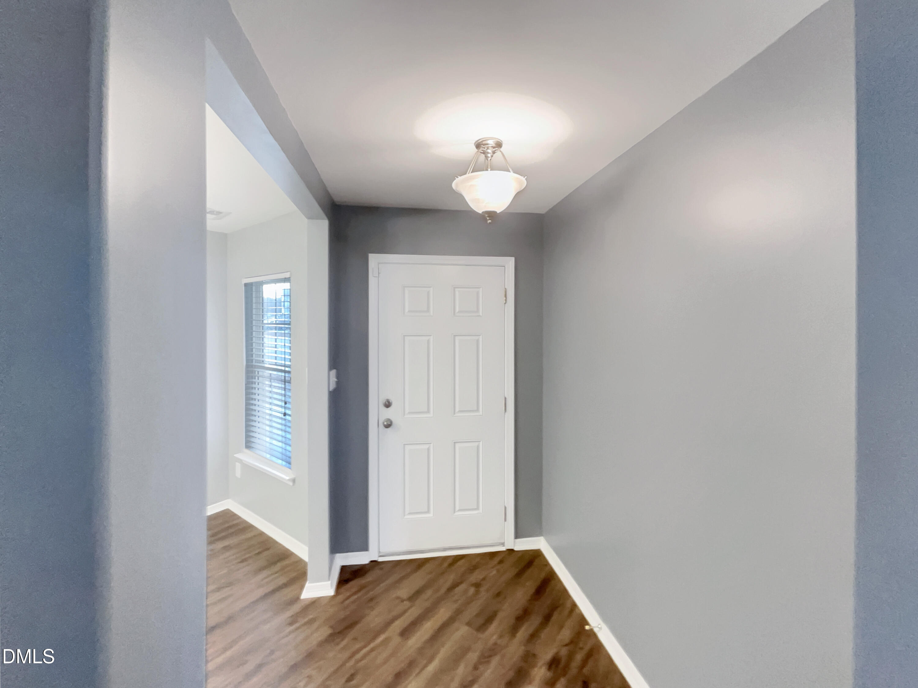 5400 Thunderidge Drive Raleigh, NC 27610 - Photo 8 of 15 a view of livingroom with hallway and wooden floor