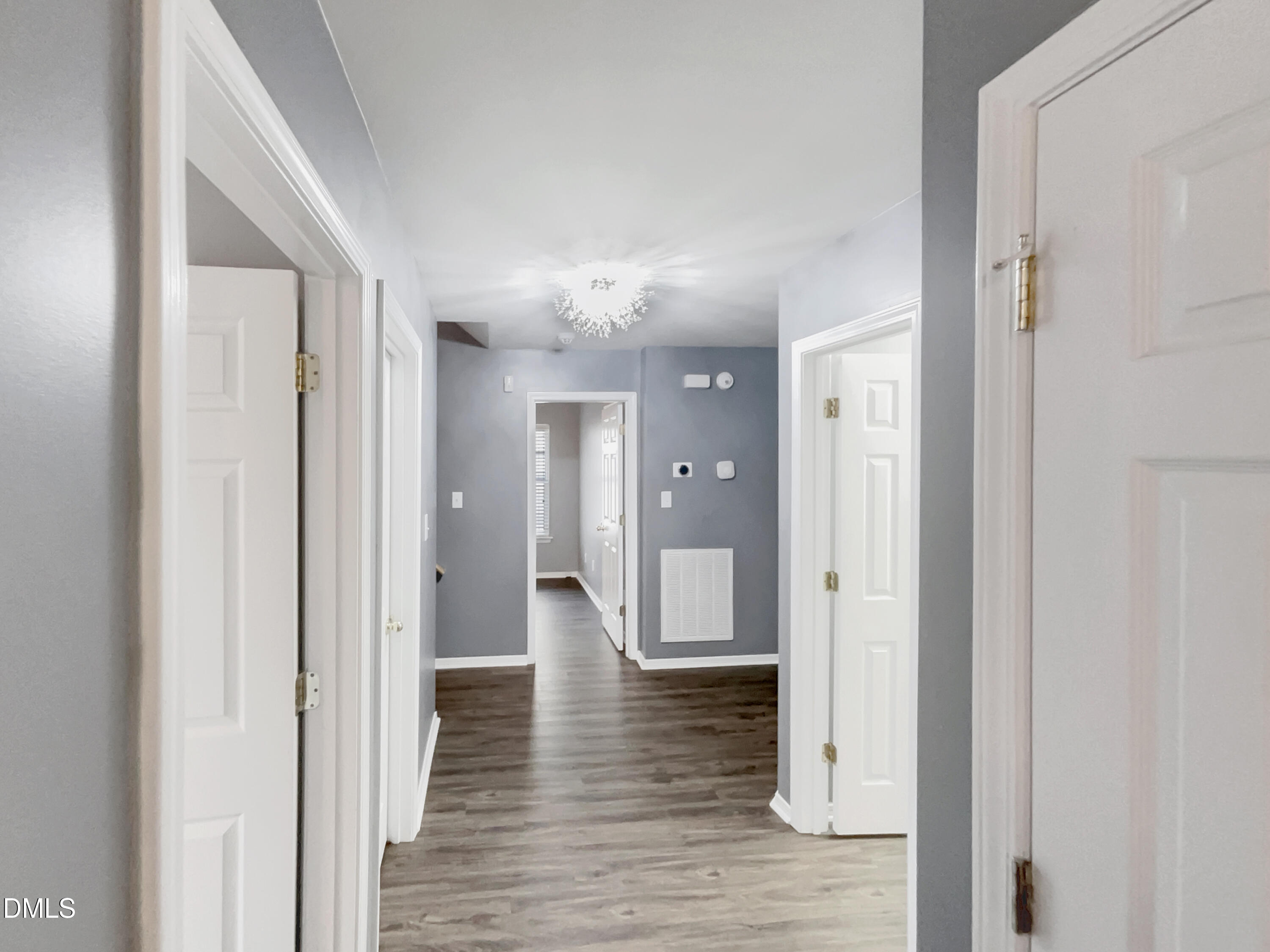 5400 Thunderidge Drive Raleigh, NC 27610 - Photo 9 of 15 a view of a hallway with wooden floor