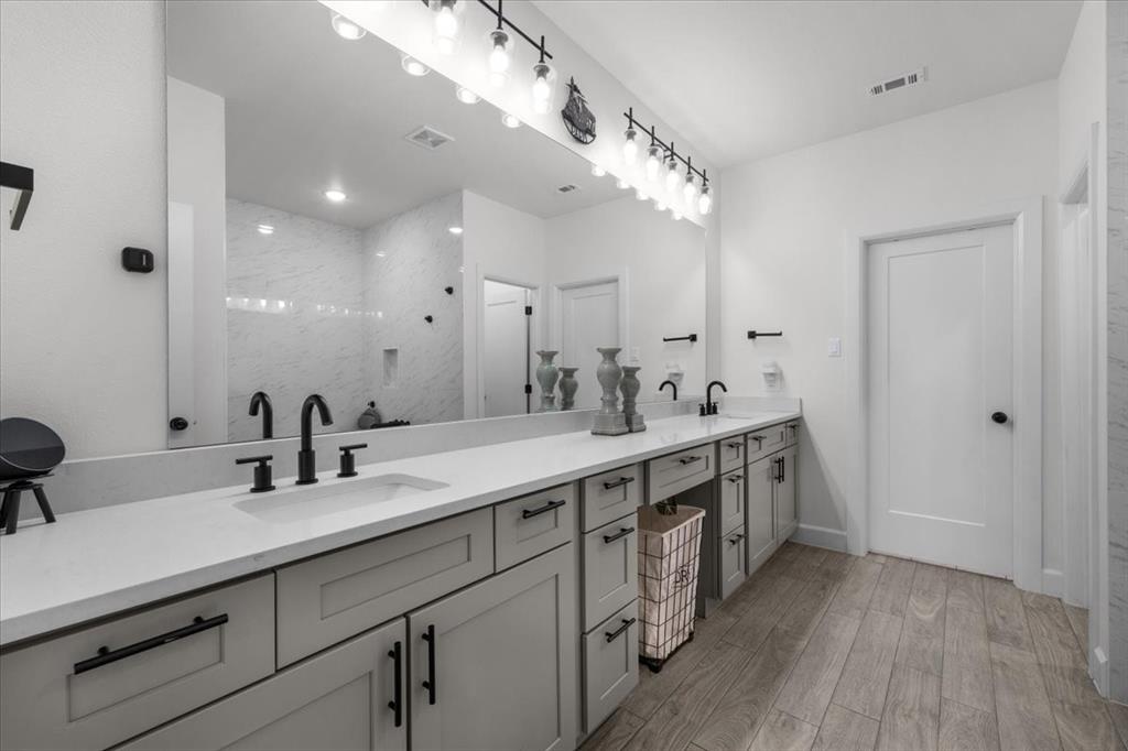 1039 Monaco Court Springtown, TX 76082 - Photo 16 of 33 Primary bathroom featuring dual sinks