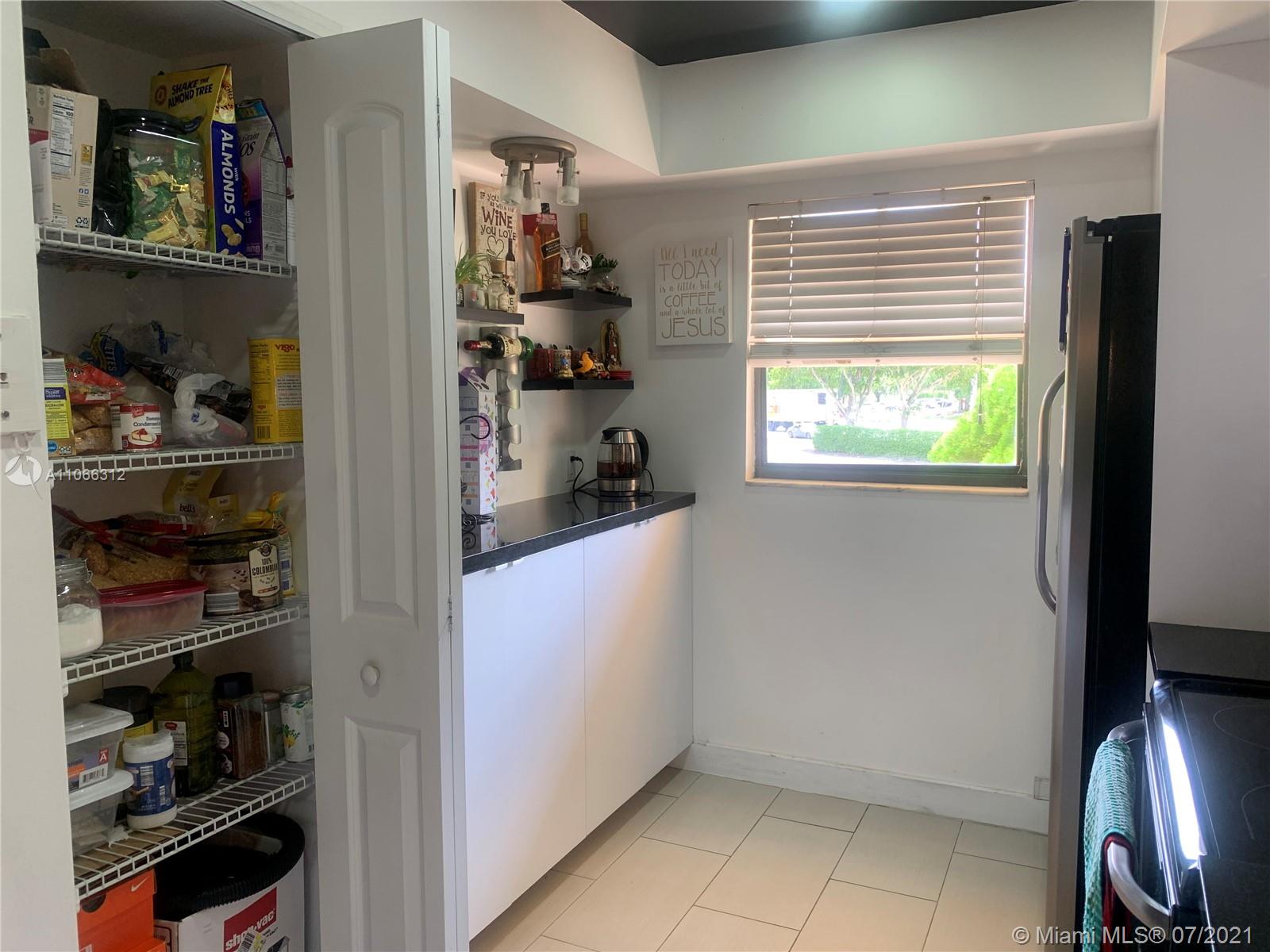 4018 Del Rio Way, Unit 4018 Sunrise, FL 33351 - Photo 18 of 94 a view of kitchen and window