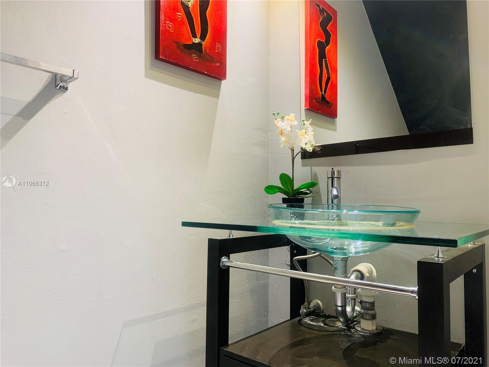 4018 Del Rio Way, Unit 4018 Sunrise, FL 33351 - Photo 23 of 94 a room with stainless steel appliances a sink and a potted plant