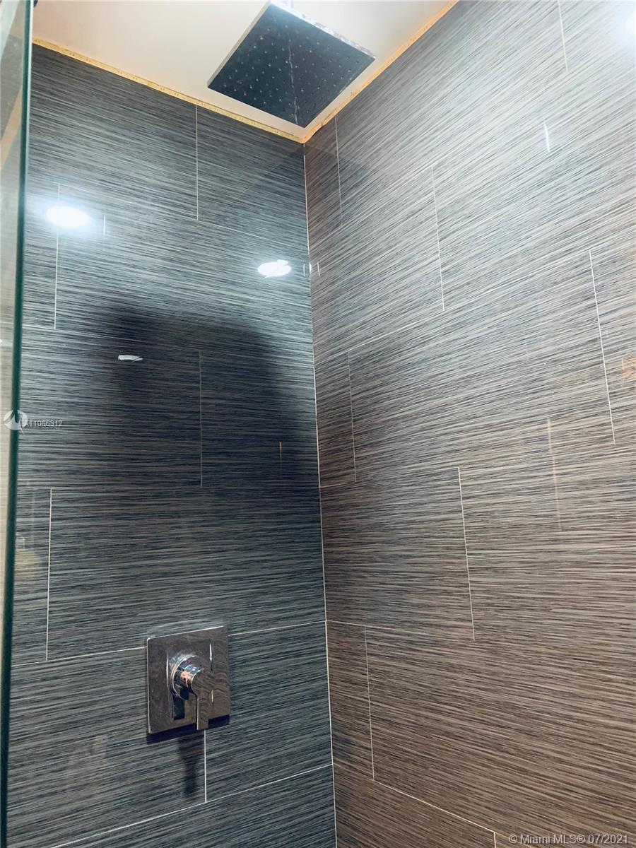 4018 Del Rio Way, Unit 4018 Sunrise, FL 33351 - Photo 33 of 94 a bathroom with a shower