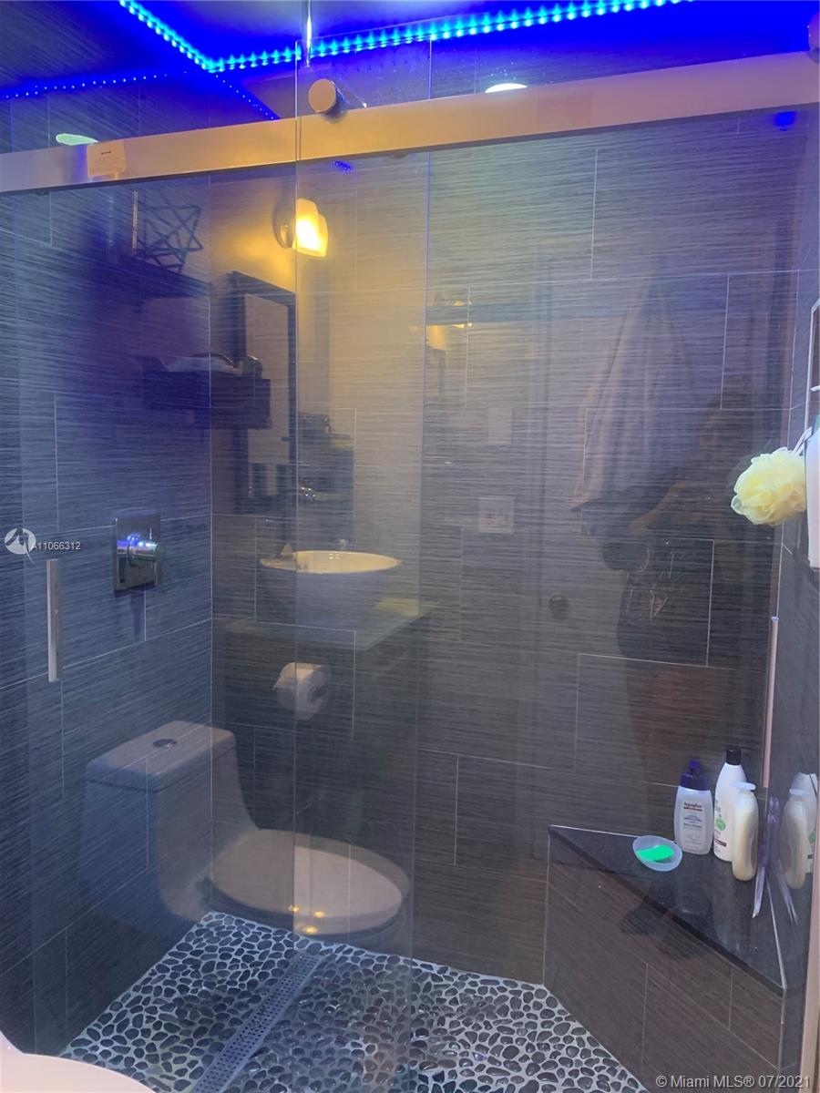 4018 Del Rio Way, Unit 4018 Sunrise, FL 33351 - Photo 35 of 94 a bathroom with a shower