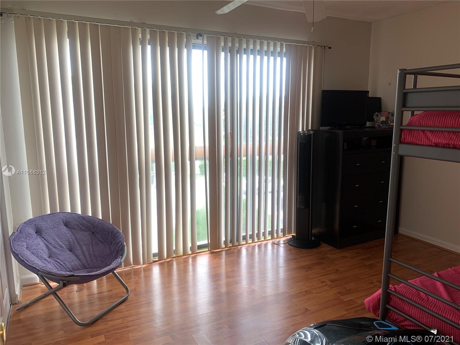 4018 Del Rio Way, Unit 4018 Sunrise, FL 33351 - Photo 58 of 94 a view of livingroom with furniture and a window