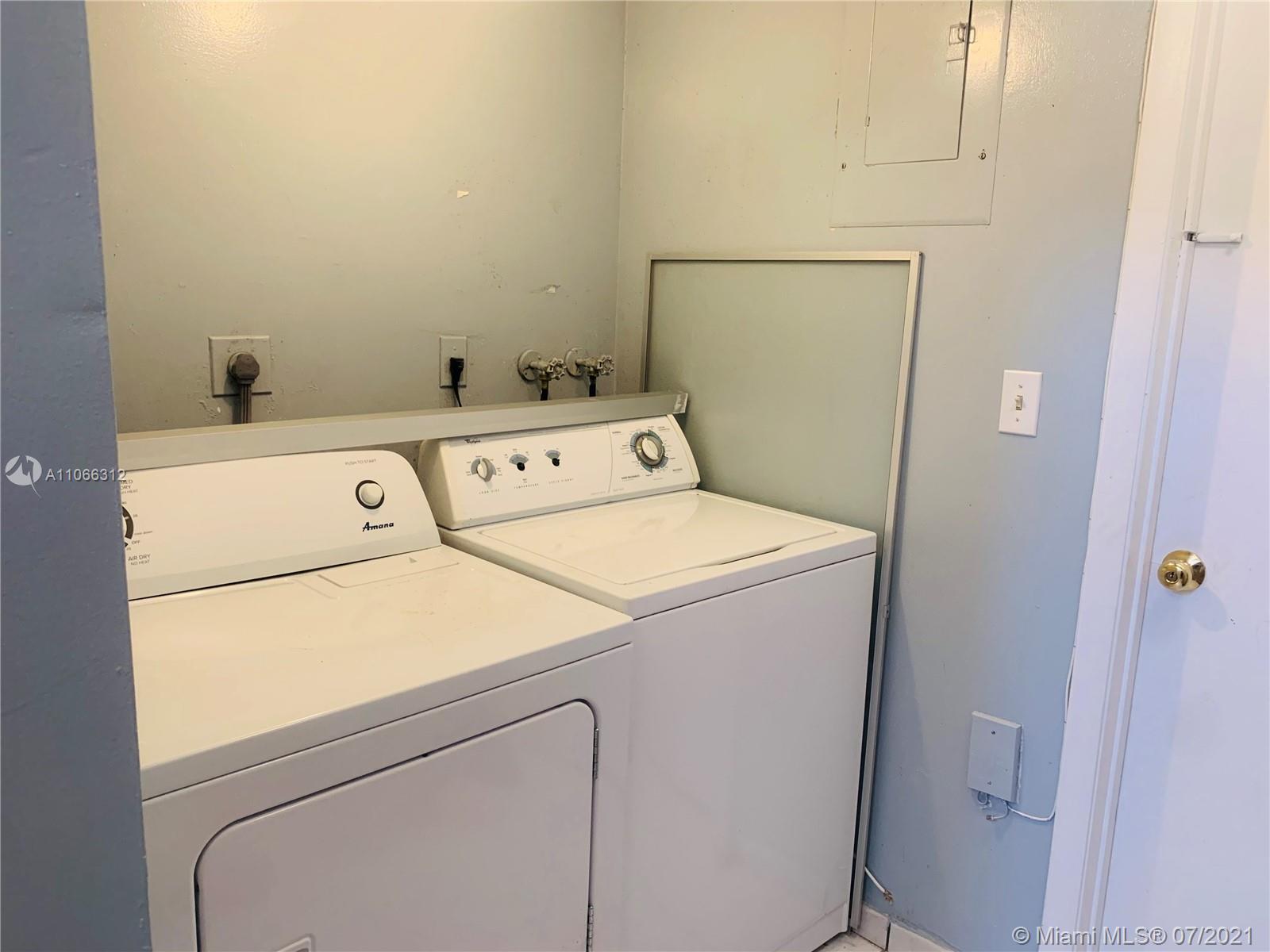 4018 Del Rio Way, Unit 4018 Sunrise, FL 33351 - Photo 65 of 94 a utility room with dryer and washer