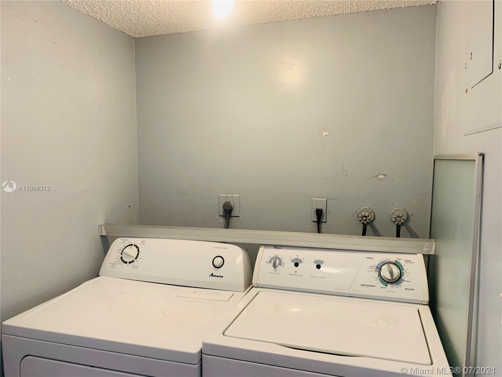 4018 Del Rio Way, Unit 4018 Sunrise, FL 33351 - Photo 66 of 94 a utility room with dryer and washer