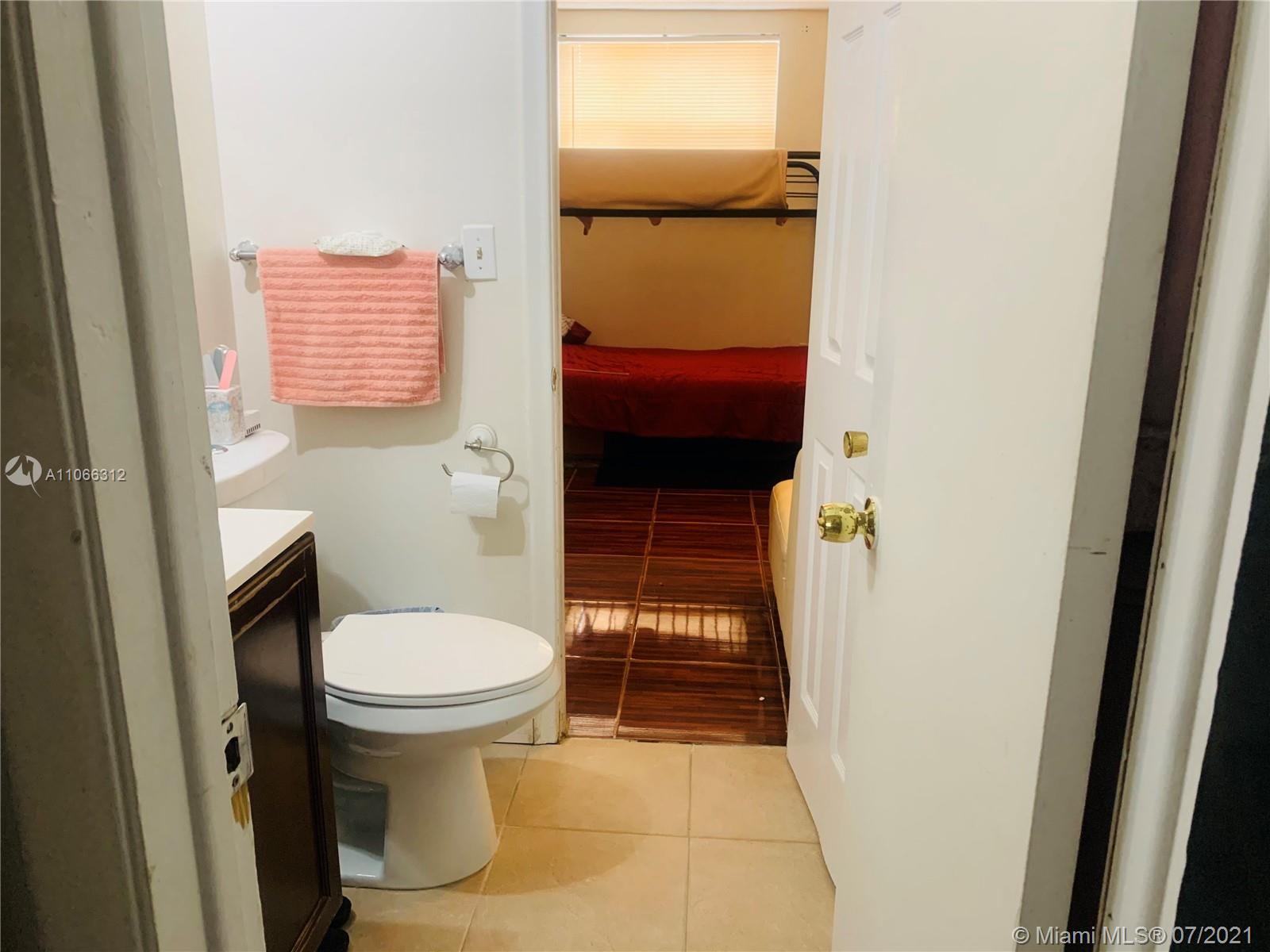 4018 Del Rio Way, Unit 4018 Sunrise, FL 33351 - Photo 70 of 94 a bathroom with a toilet and a shower