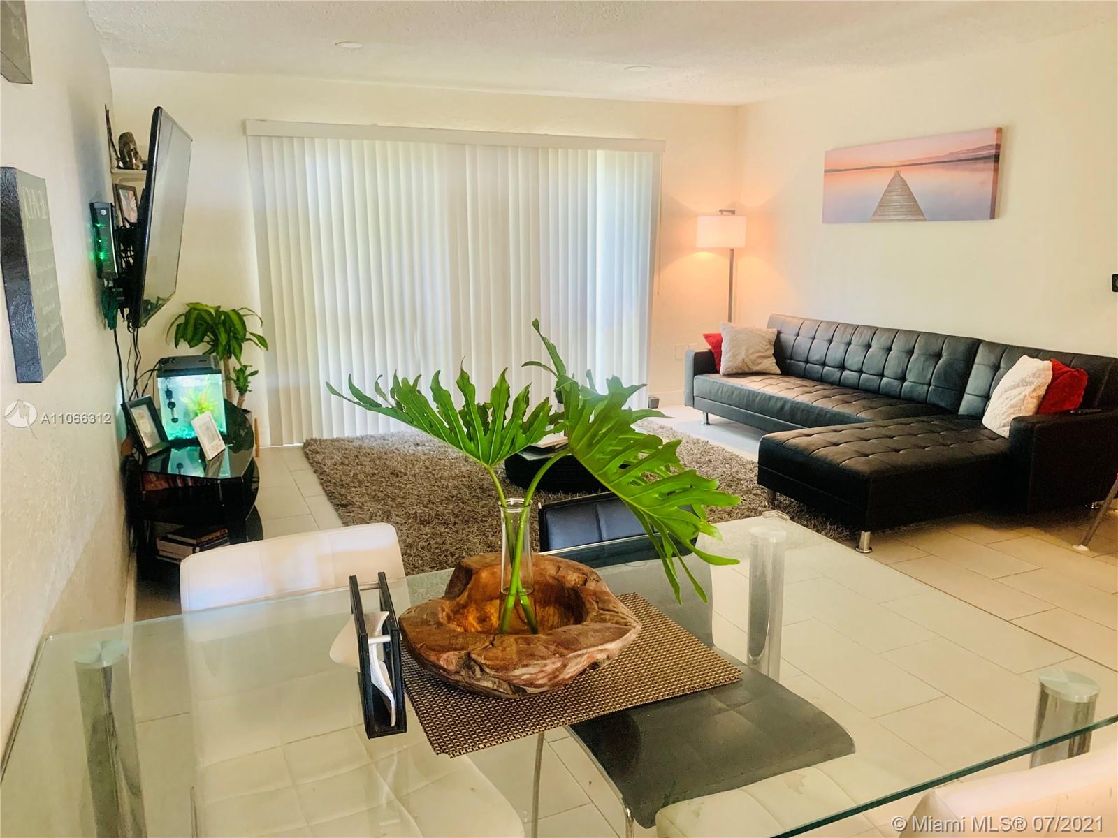 4018 Del Rio Way, Unit 4018 Sunrise, FL 33351 - Photo 8 of 94 a living room with furniture and a potted plant