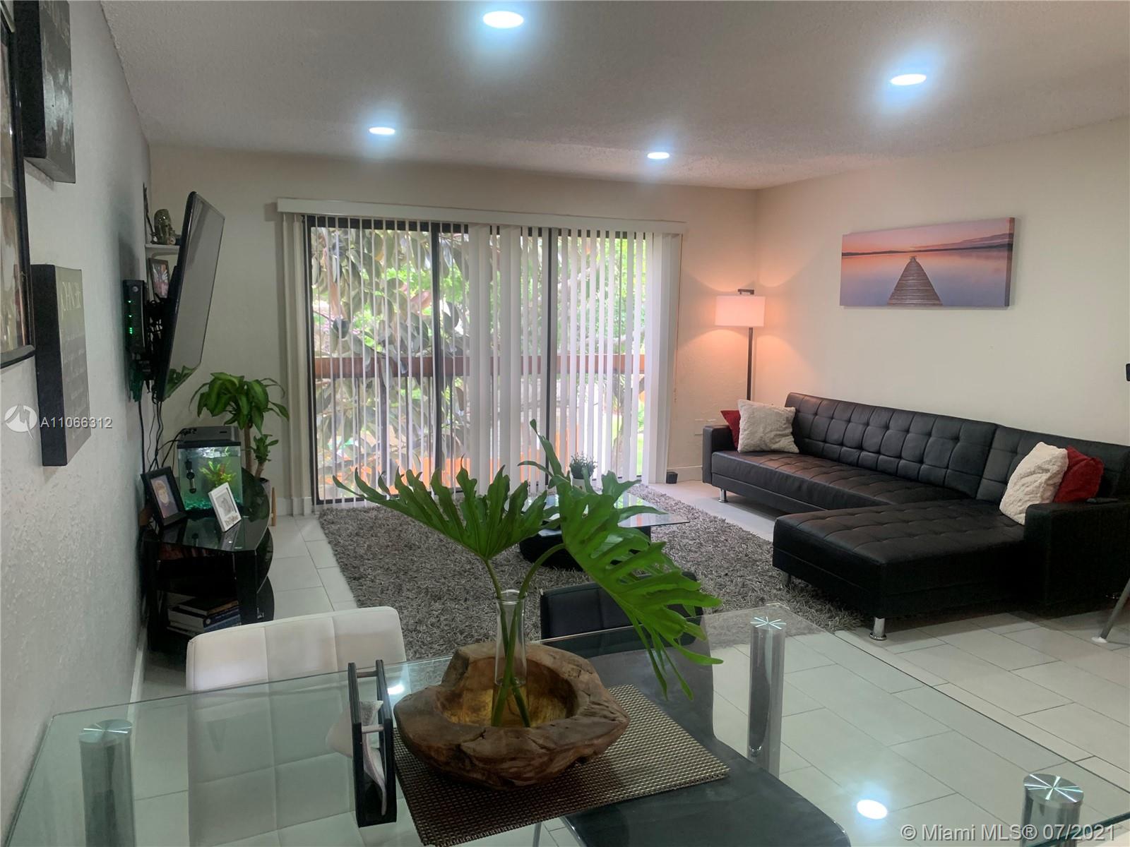 4018 Del Rio Way, Unit 4018 Sunrise, FL 33351 - Photo 9 of 94 a living room with furniture and a potted plant