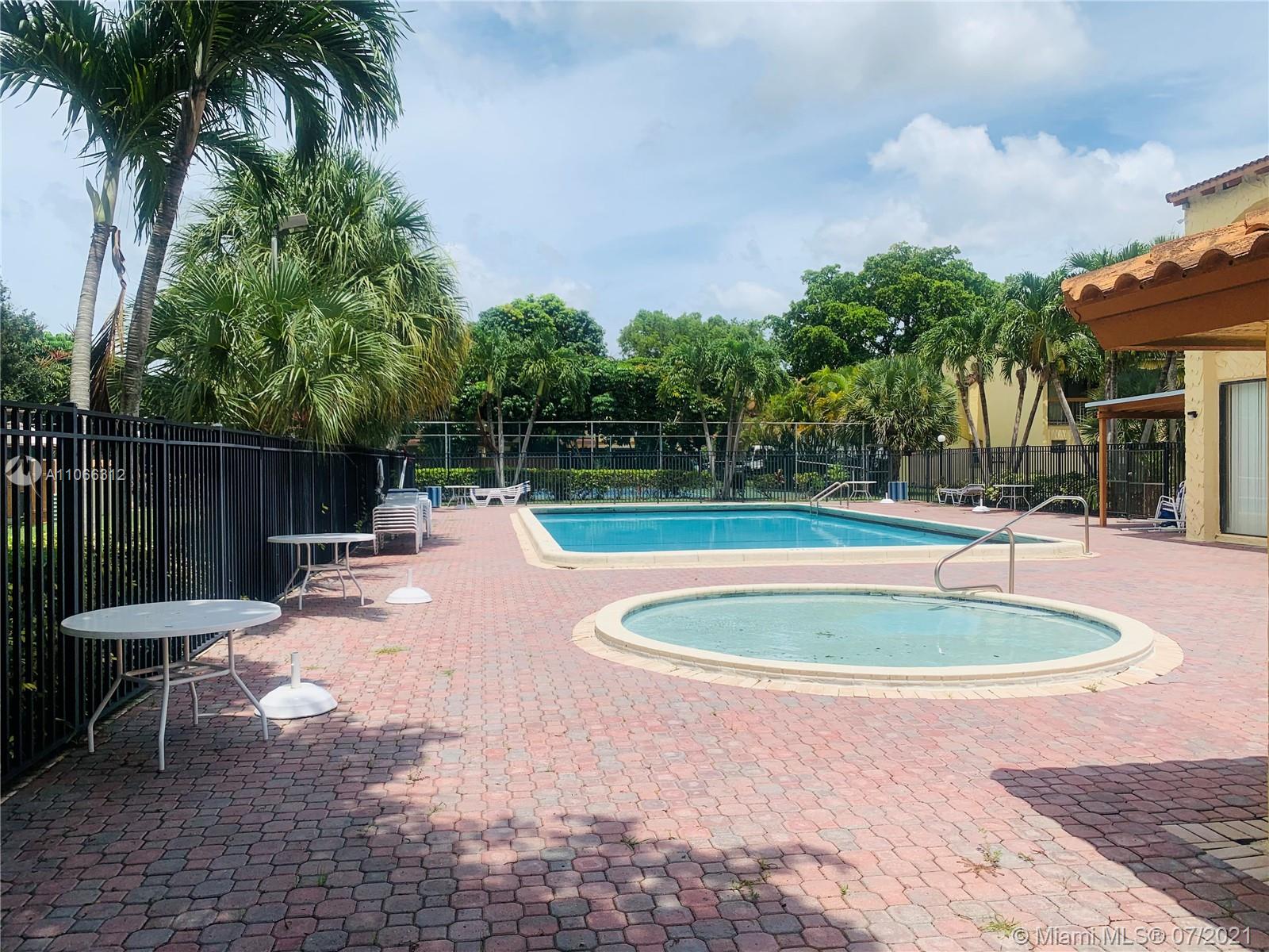 4018 Del Rio Way, Unit 4018 Sunrise, FL 33351 - Photo 85 of 94 a view of a swimming pool with a patio
