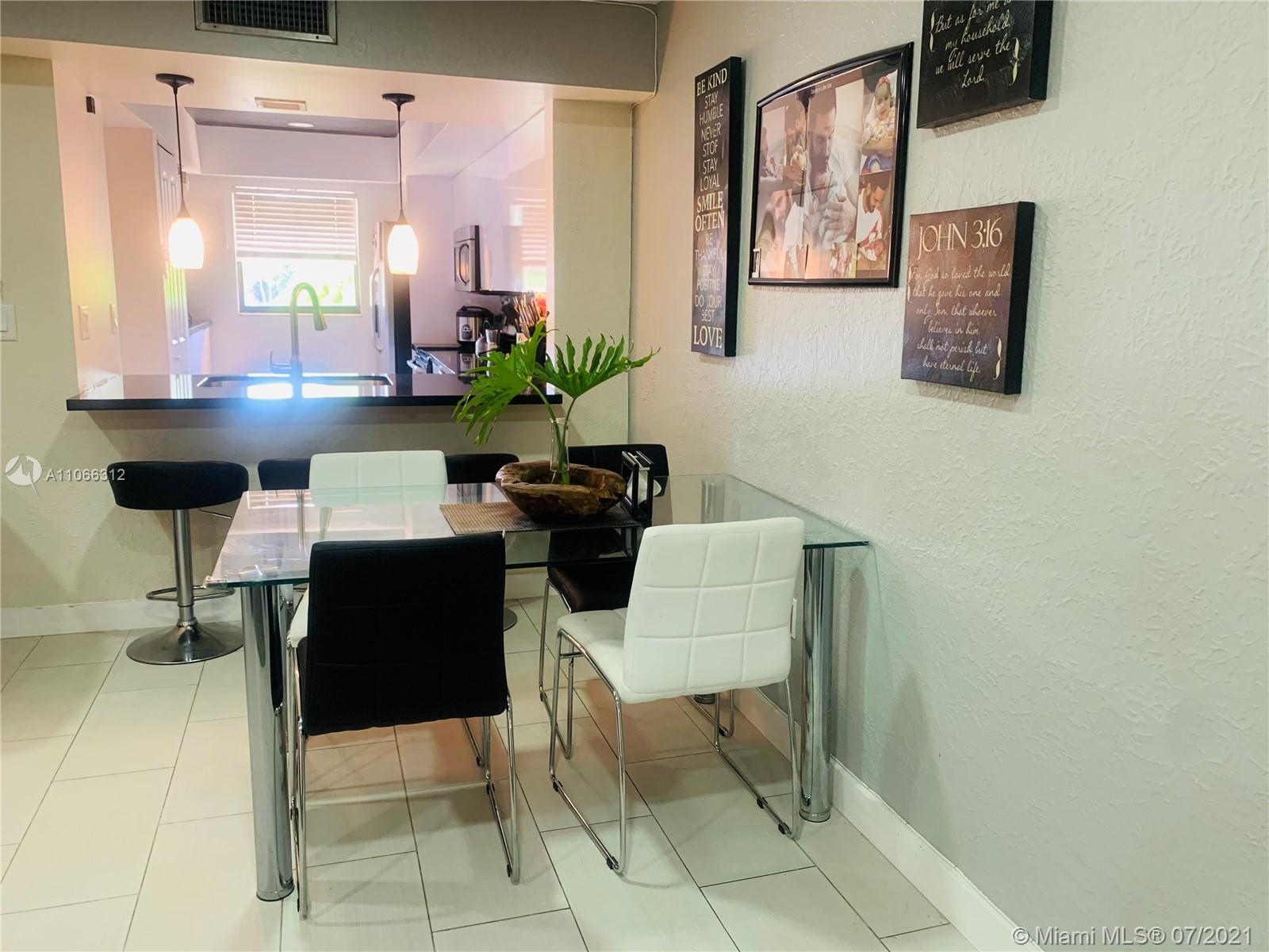 4018 Del Rio Way, Unit 4018 Sunrise, FL 33351 - Photo 10 of 94 a living room with furniture and a potted plant