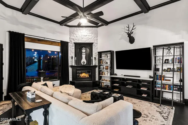 a kitchen with a table chairs and flat screen tv