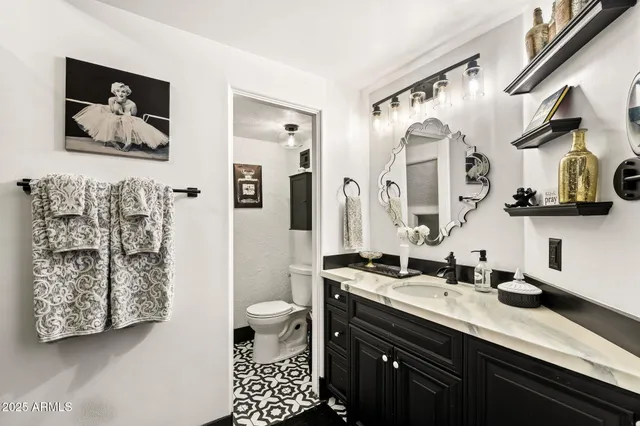 a bedroom with bed and flat screen tv