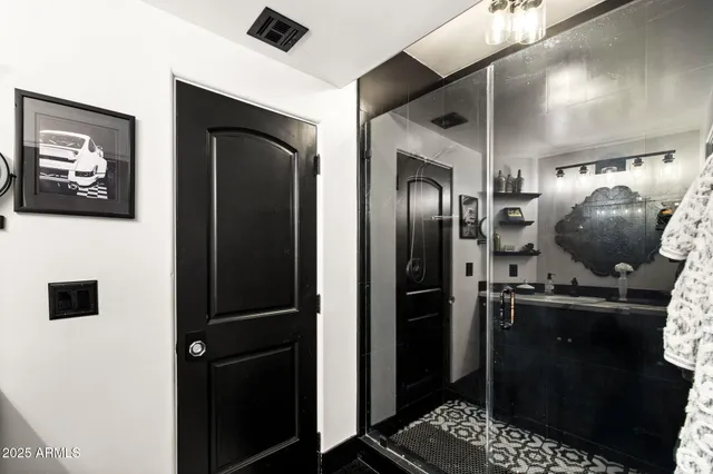 a kitchen with a sink cabinets and appliances