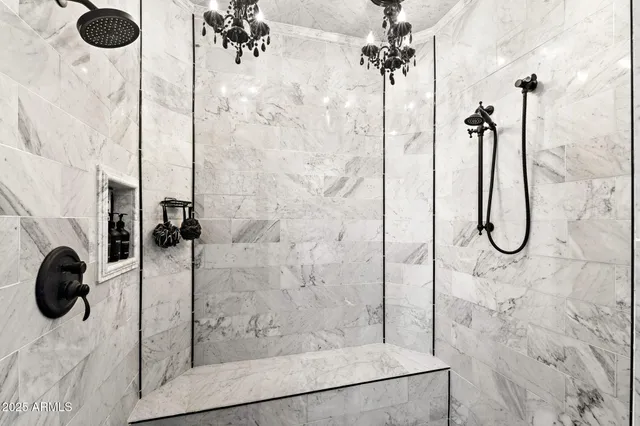 a bathroom with double vanity sink and a mirror