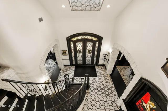 a bathroom with a toilet a sink and shower