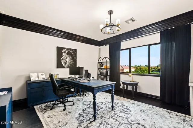 a view of a house with pool and chairs