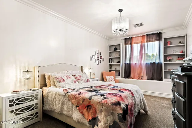 a view of a backyard with table and chairs with an umbrella