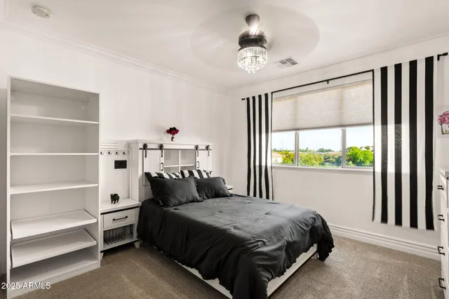 a view of a chairs and table in a backyard