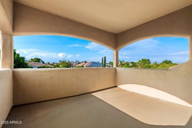a view of a dining room with furniture a chandelier and wooden floor