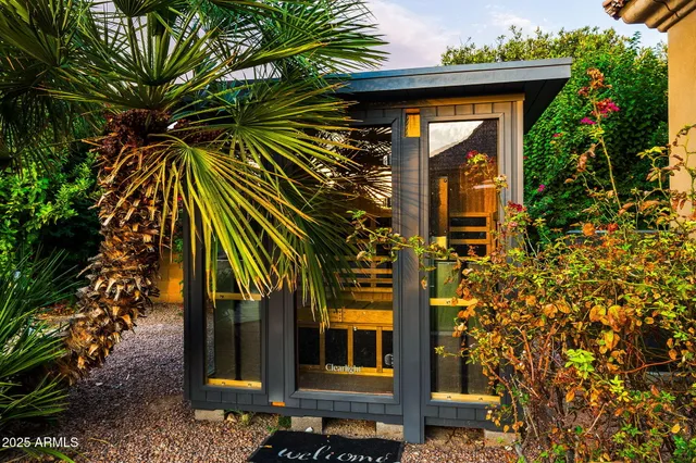 a view of a swimming pool and chairs