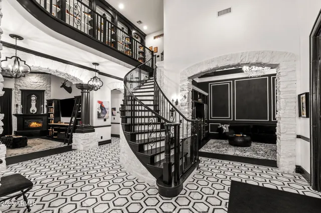 a view of a living room with furniture and a chandelier