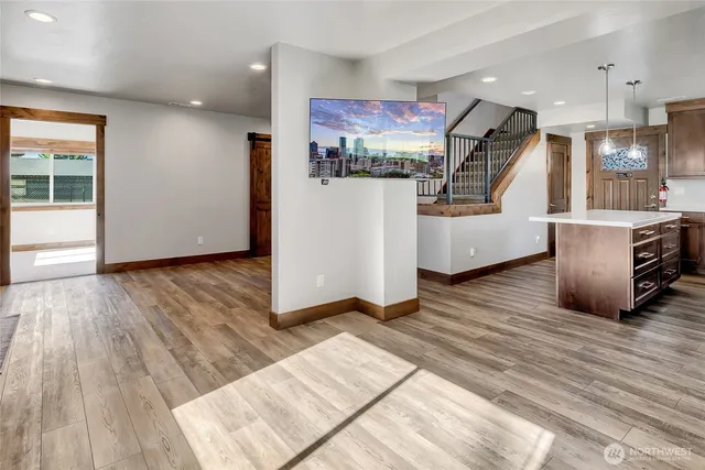 a view of kitchen with furniture and wooden floor