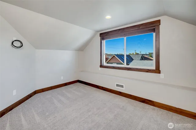 a view of a room with painting on the wall