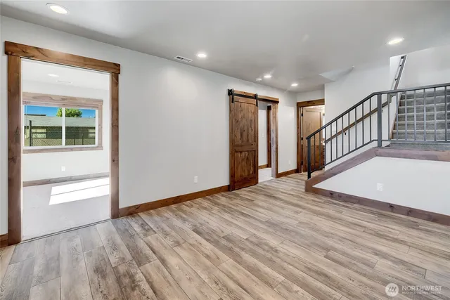 a view of an entryway with wooden floor