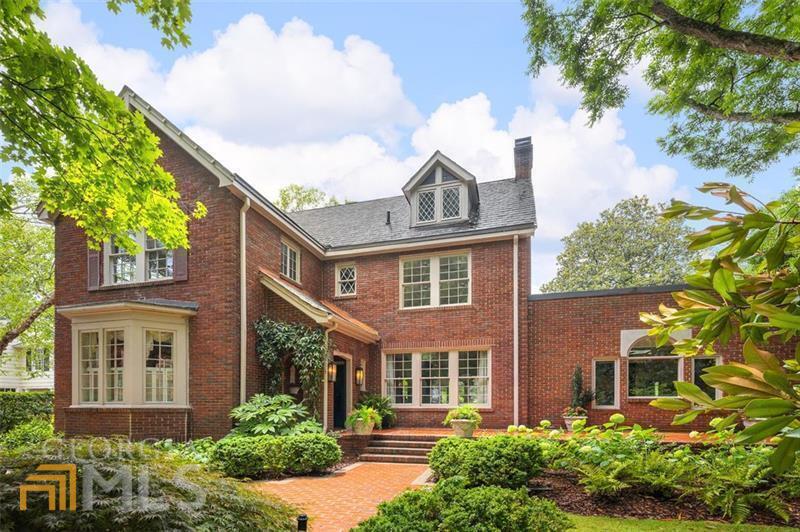 1206 Oakdale Road Northeast Atlanta, GA 30307 - Photo 1 of 1 a front view of a house with a garden