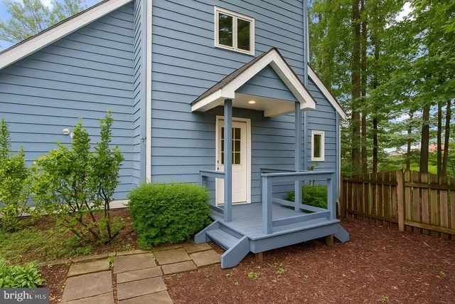 a view of a hallway view with wooden floor and staircase