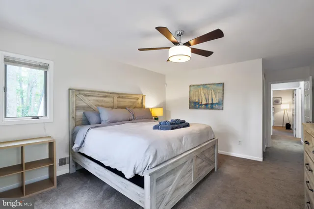 a bathroom with a sink vanity and a mirror