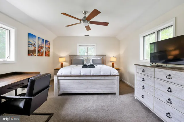 a bedroom with a bed and chair