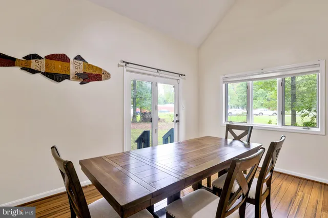 a work room with furniture and wooden floor