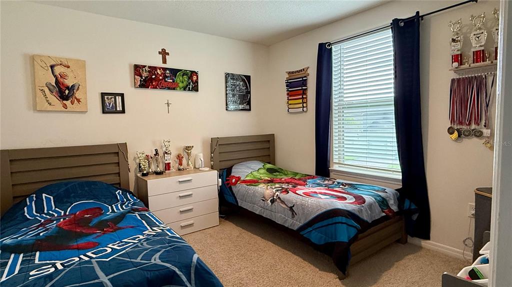 13340 Pontoon Road Winter Garden, FL 34787 - Photo 8 of 15 a bedroom with a bed and a window
