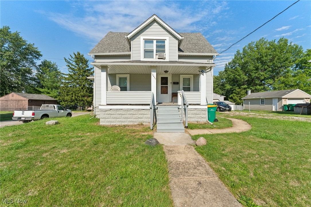 14631 Granger Road Maple Heights, OH 44137 - Photo 1 of 31 Bungalow-style home with a front yard and covered porch