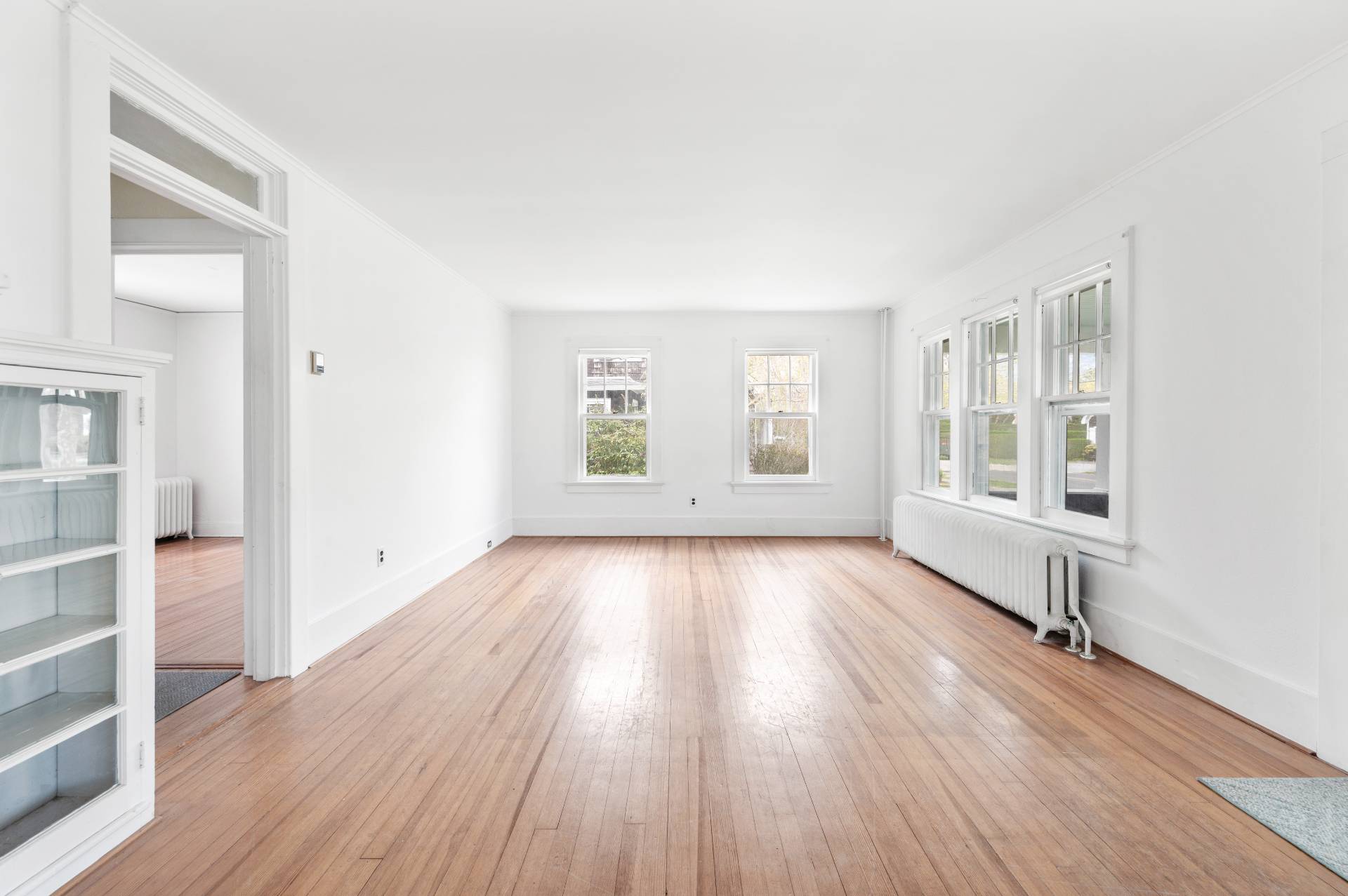 41 Sherrill Road East Hampton, NY 11937 - Photo 14 of 24 an empty room with wooden floor and windows