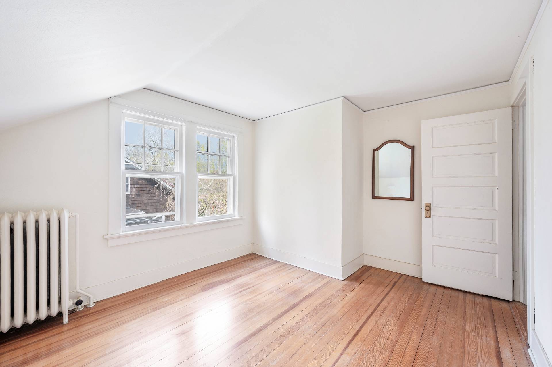 41 Sherrill Road East Hampton, NY 11937 - Photo 20 of 24 an empty room with wooden floor and window