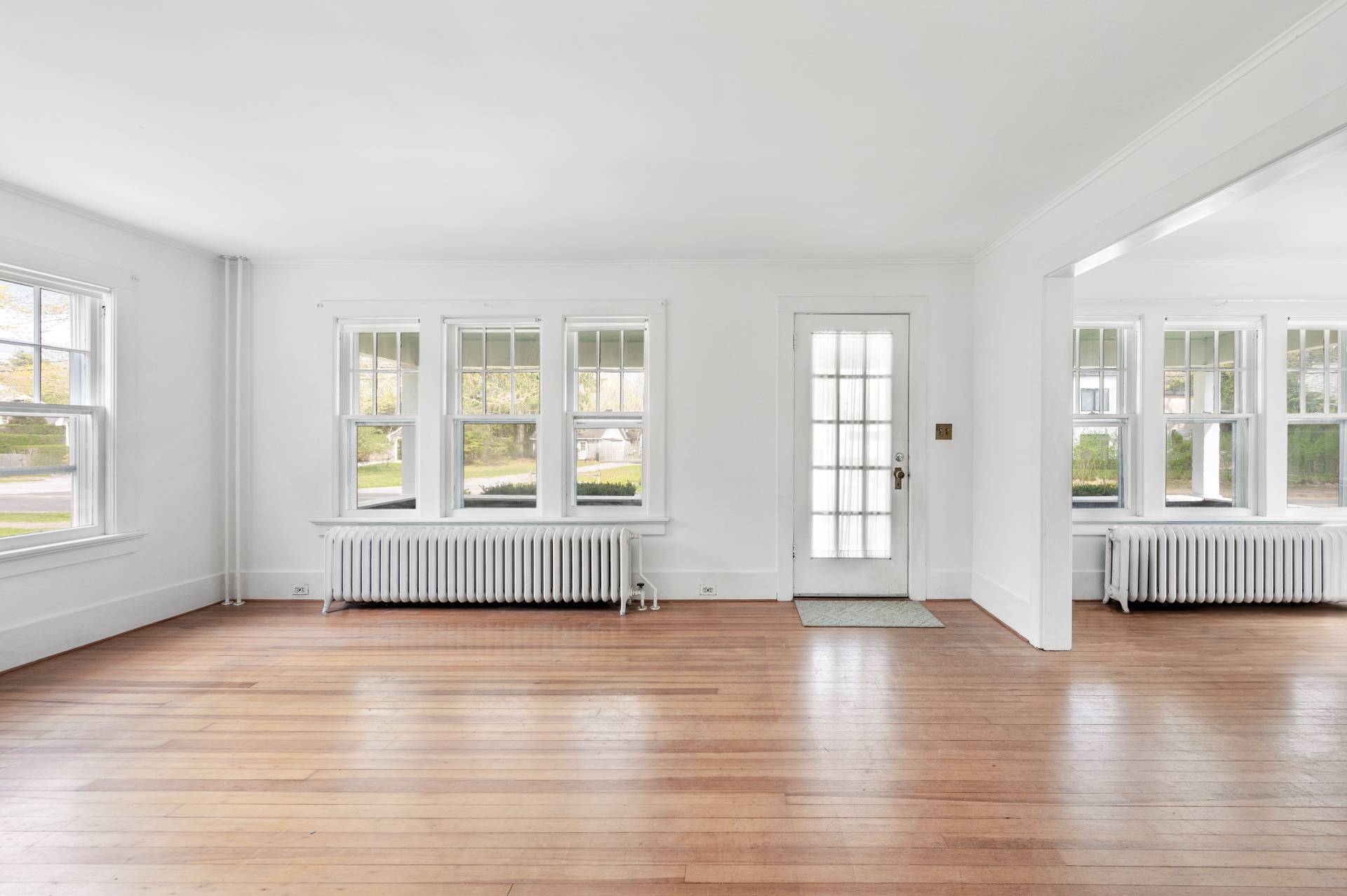 41 Sherrill Road East Hampton, NY 11937 - Photo 8 of 24 an empty room with wooden floor and windows