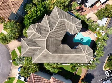 a utility room with dryer and white walls