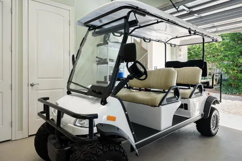 a dining room with furniture and a large window